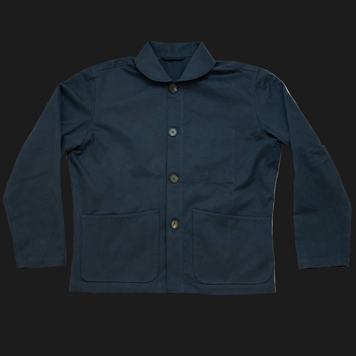 A dark navy blue mistle jacket with a pointed collar, three-quarter button closure, and two large front patch pockets, shown flat on a white background.
