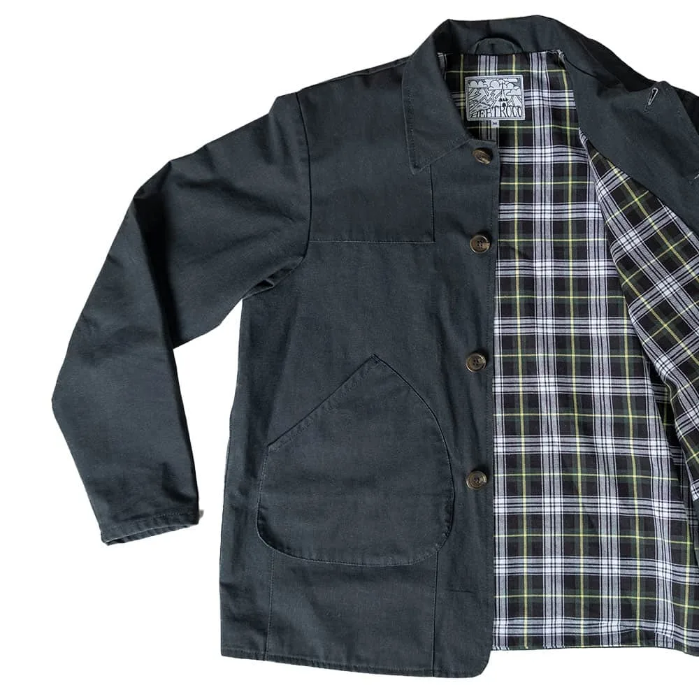 The gunpowder HebTroCo Jacksnipe Overjacket with a tartan lining